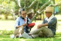 Asian Lifestyle senior couple surprise gift for special day in the nature park happy and relax time.